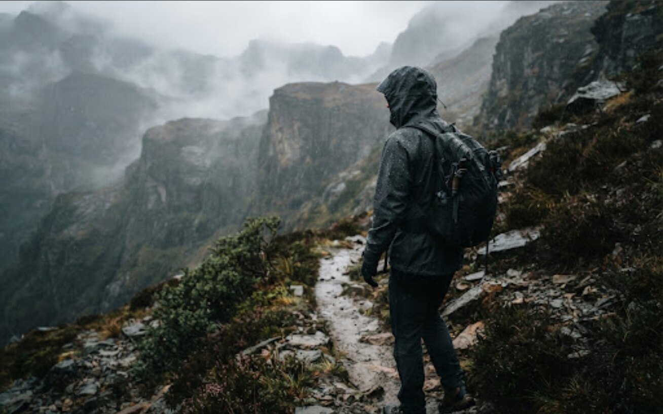 Rain ready technical jacket on misty ridge