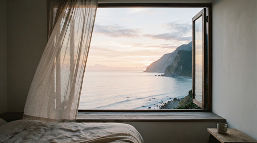 Pacific ocean seen from bedroom window at dawn